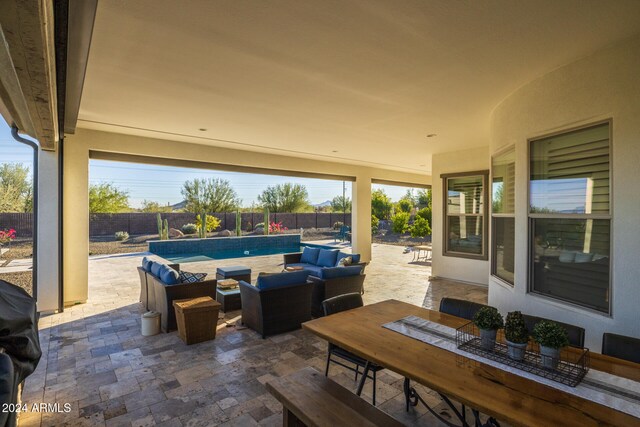 view of patio / terrace featuring a fenced in pool and an outdoor hangout area