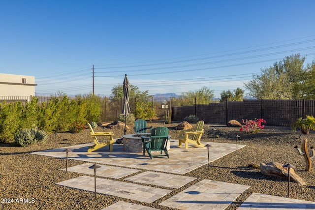 view of patio with a fire pit