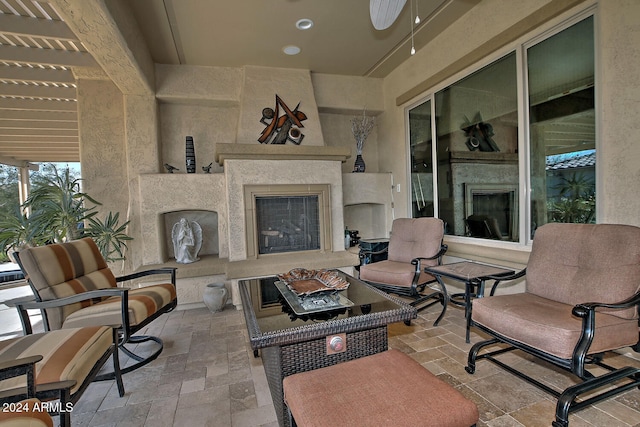 view of patio / terrace featuring exterior fireplace