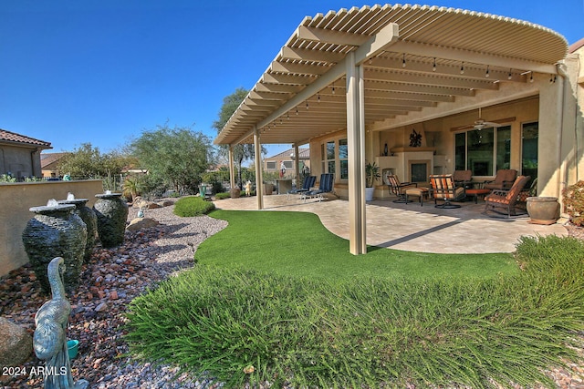 view of yard with a pergola, a patio area, and ceiling fan