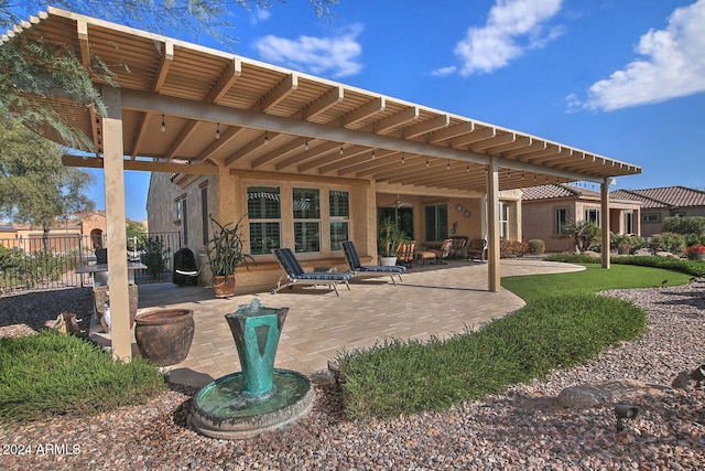 back of house with a patio