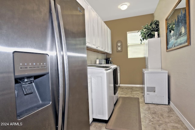 washroom with cabinets and independent washer and dryer