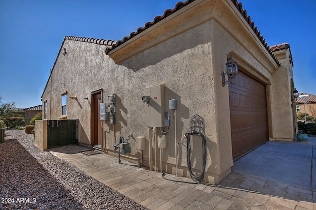 view of property exterior with a garage