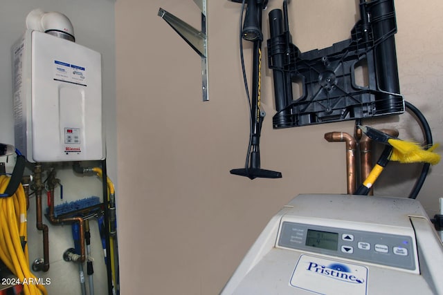 utility room with tankless water heater