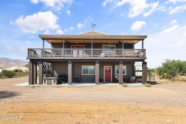 back of house with a deck with mountain view