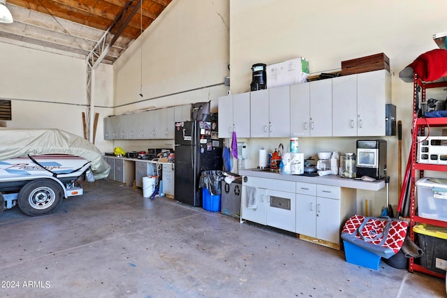 garage featuring black refrigerator