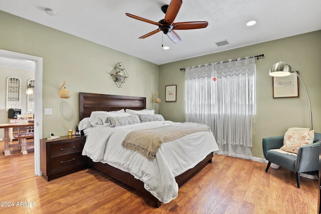 bedroom featuring ceiling fan and light wood-type flooring