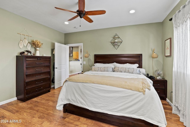 bedroom featuring light hardwood / wood-style flooring and ceiling fan