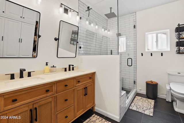 bathroom with toilet, an enclosed shower, vanity, and tile patterned flooring