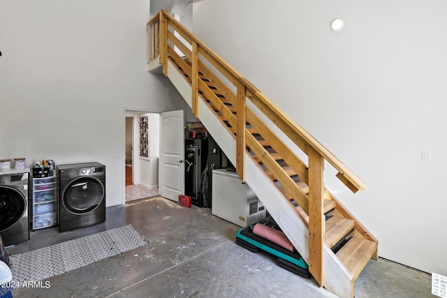 interior space featuring independent washer and dryer and concrete floors