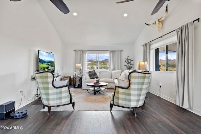 living room featuring dark wood-type flooring, plenty of natural light, and ceiling fan