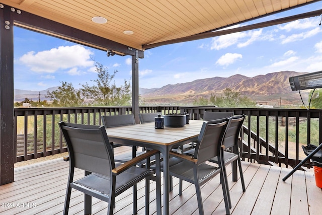 wooden deck featuring a mountain view