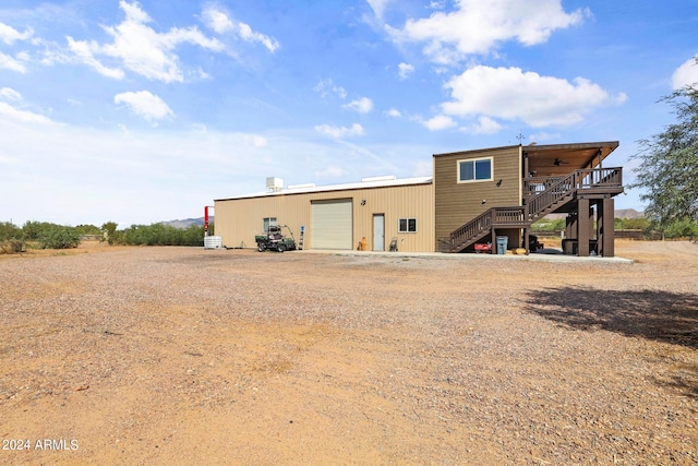 back of house with a garage