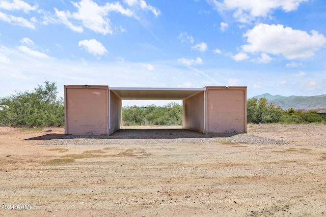 view of outbuilding with a mountain view