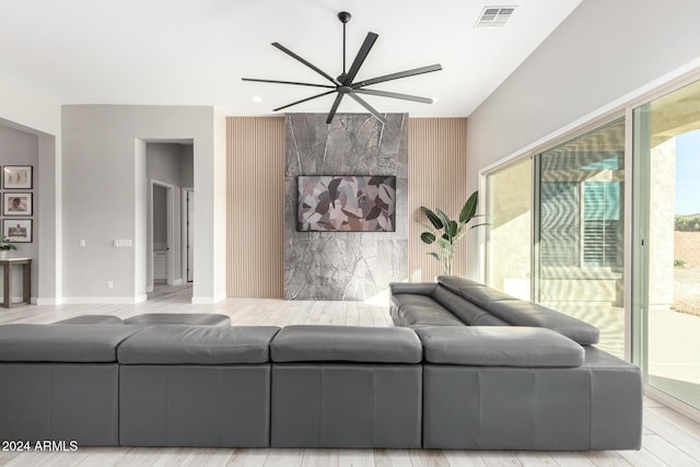 living room with ceiling fan and light hardwood / wood-style floors