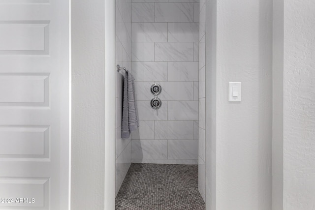 bathroom with tiled shower