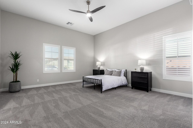 bedroom with light carpet and ceiling fan