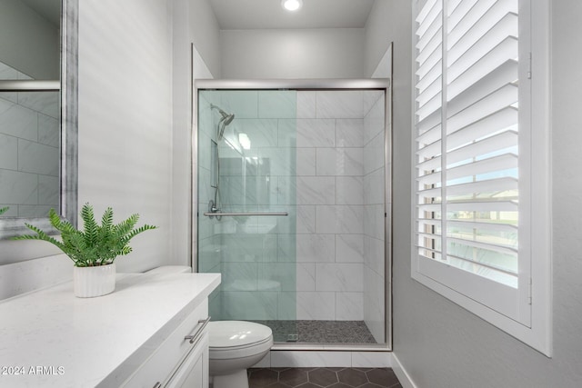 bathroom with toilet, walk in shower, tile patterned floors, and vanity