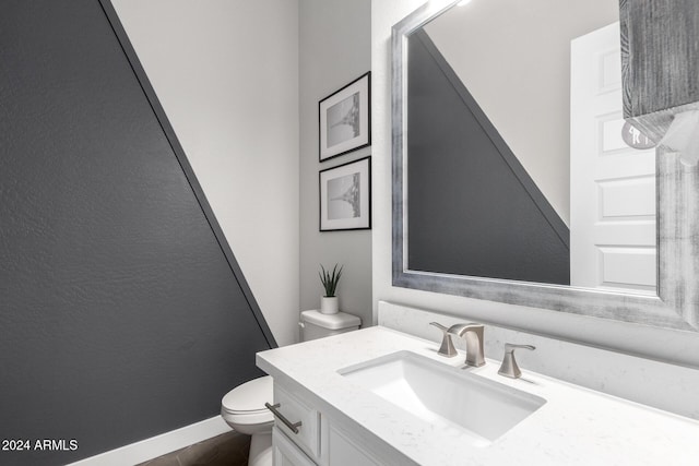 bathroom with toilet and vanity