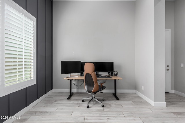 office space with light wood-type flooring