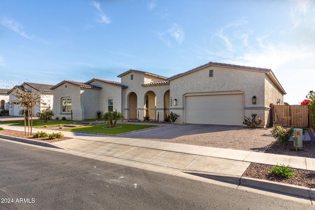 mediterranean / spanish house featuring a garage