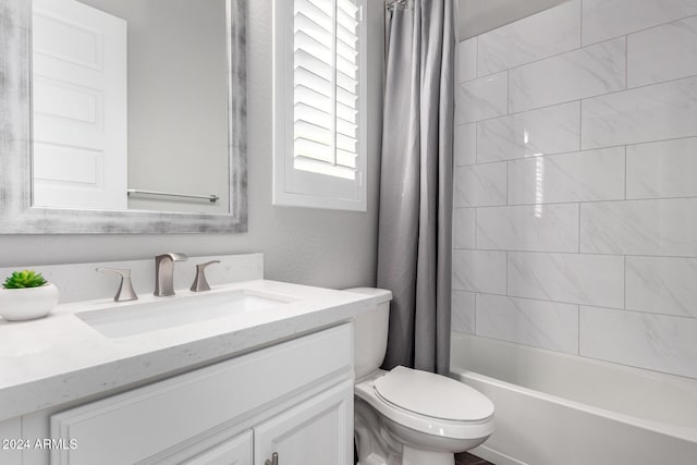 full bathroom featuring toilet, shower / tub combo, and vanity