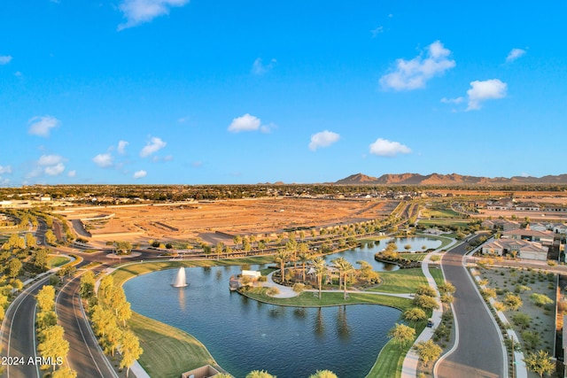 birds eye view of property featuring a water and mountain view