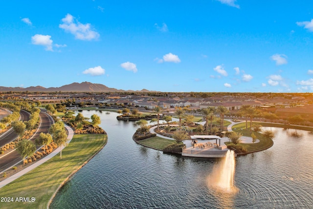 drone / aerial view with a water and mountain view