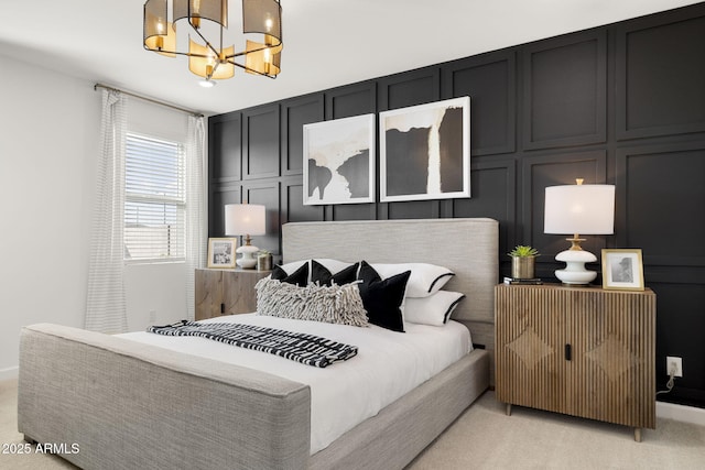 bedroom featuring light colored carpet and a chandelier