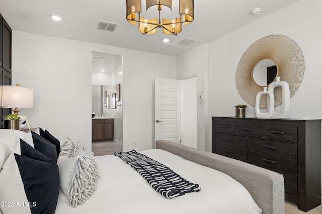 bedroom with an inviting chandelier and ensuite bath