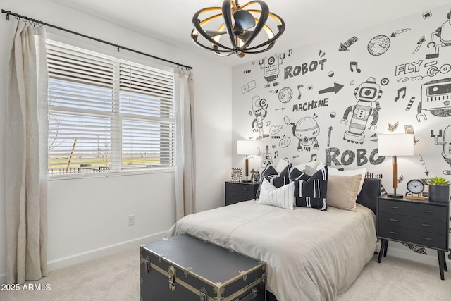 bedroom featuring carpet and a chandelier