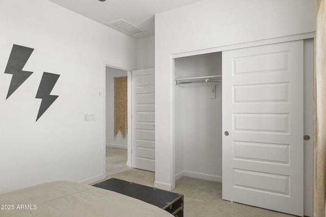 carpeted bedroom featuring a closet