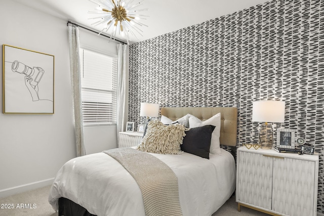 bedroom with light carpet and a chandelier