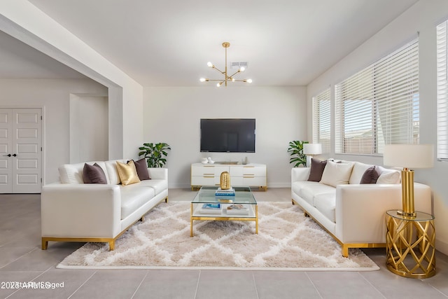 22876 E Via Del Sol, Queen Creek, AZ 85142 - living room featuring a chandelier, tile patterned floors, and baseboards
