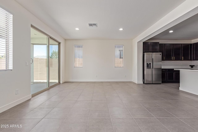 22876 E Via Del Sol, Queen Creek, AZ 85142 - unfurnished living room featuring light tile patterned floors, recessed lighting, and baseboards