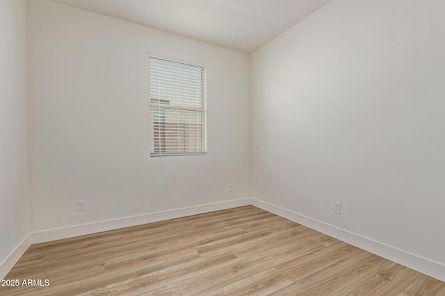 22876 E Via Del Sol, Queen Creek, AZ 85142 - empty room featuring light wood-style flooring and baseboards