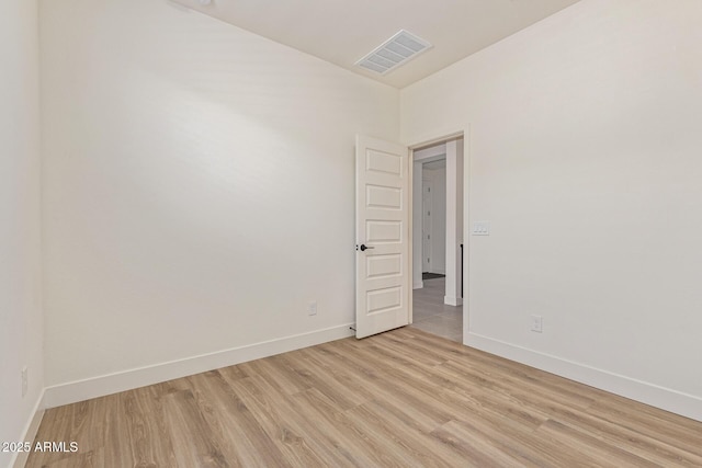 22876 E Via Del Sol, Queen Creek, AZ 85142 - unfurnished room featuring light wood-type flooring and baseboards