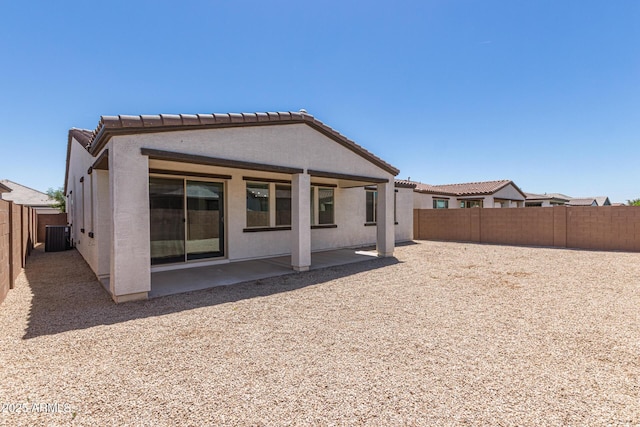 22876 E Via Del Sol, Queen Creek, AZ 85142 - rear view of property featuring a fenced backyard, a patio area, a tile roof, central AC, and stucco siding
