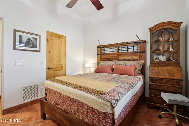 tiled bedroom featuring ceiling fan