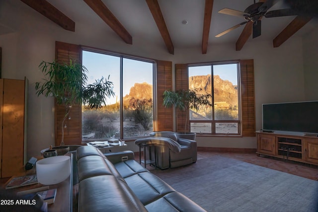 living room with ceiling fan and tile patterned flooring