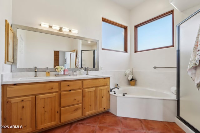 bathroom featuring independent shower and bath, tile patterned flooring, and vanity