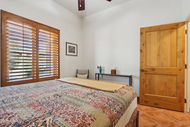 tiled bedroom with ceiling fan