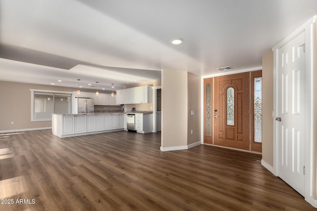 foyer entrance with recessed lighting, visible vents, dark wood finished floors, and baseboards