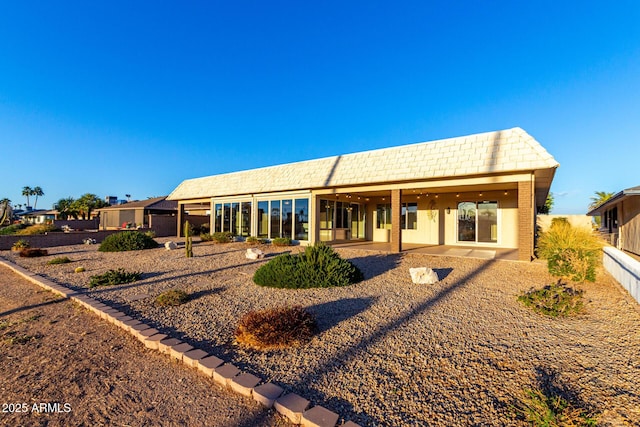 rear view of property with a patio area