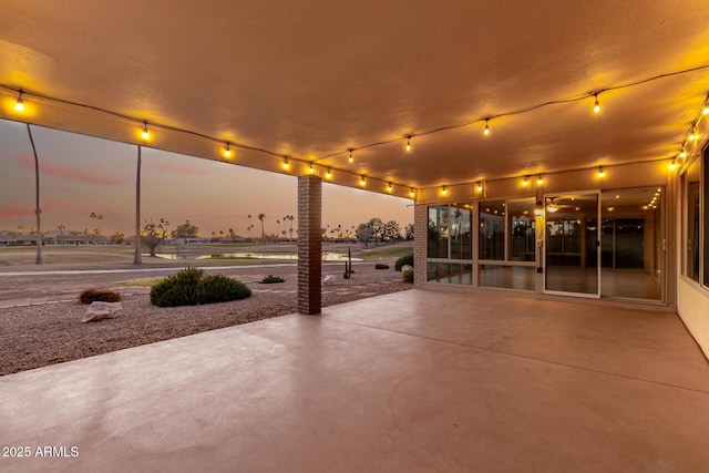 view of patio terrace at dusk