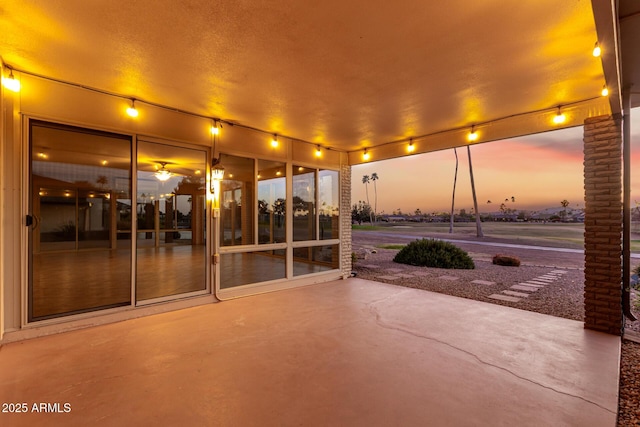 view of patio terrace at dusk