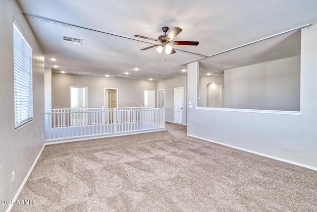 empty room featuring baseboards, visible vents, ceiling fan, carpet floors, and recessed lighting