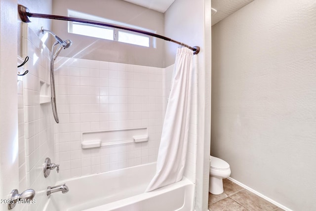 full bathroom featuring shower / tub combo, toilet, and tile patterned floors