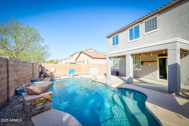 view of pool featuring a patio, a fenced backyard, a fenced in pool, and an in ground hot tub