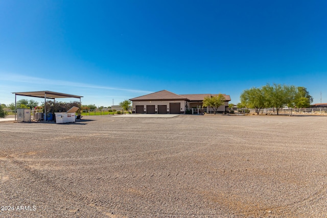 ranch-style home featuring an outbuilding and a garage